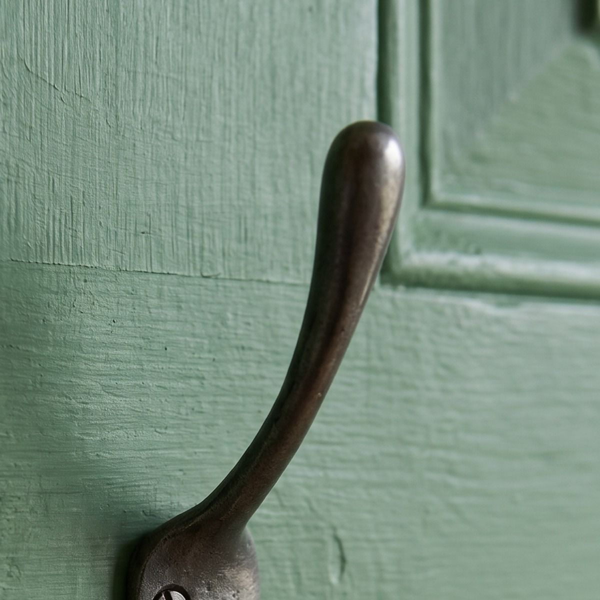The Blacksmith Vintage Cast Iron Three-Prong Hall Hook - 100mm Showing a Close up of the Upper Hook - Digital Illustration