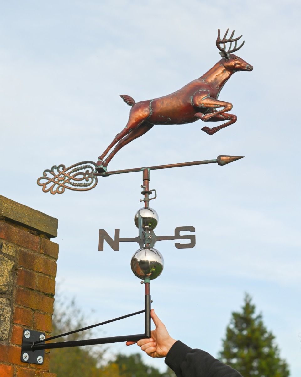The Leaping Stag Verdigris Copper Weathervane Shown with Hand in Shot for Scale