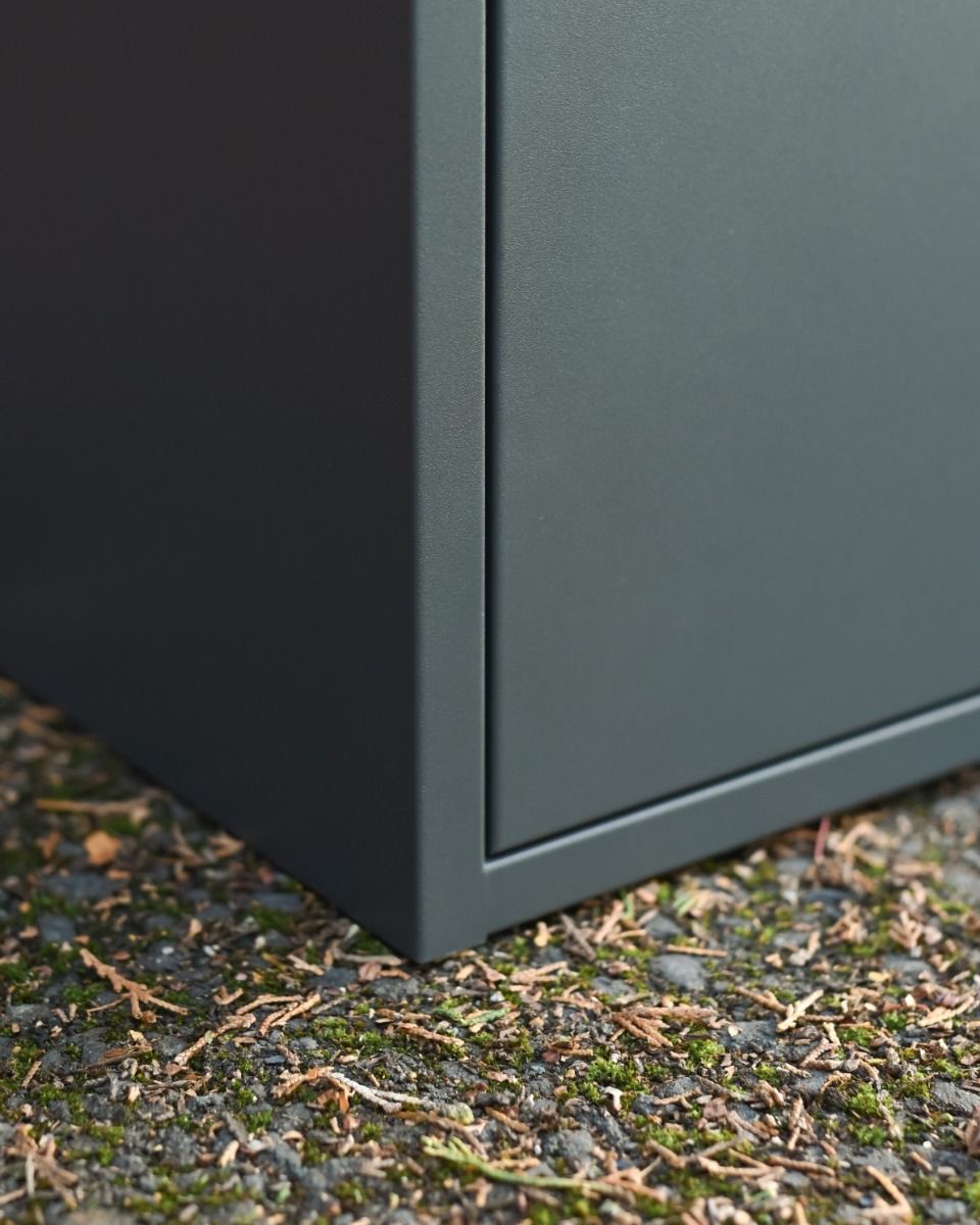 The "Titan" Medium Wall Mounted Parcel Box Steel in Grey Showing the Corner whilst it is Mounted to the Floor