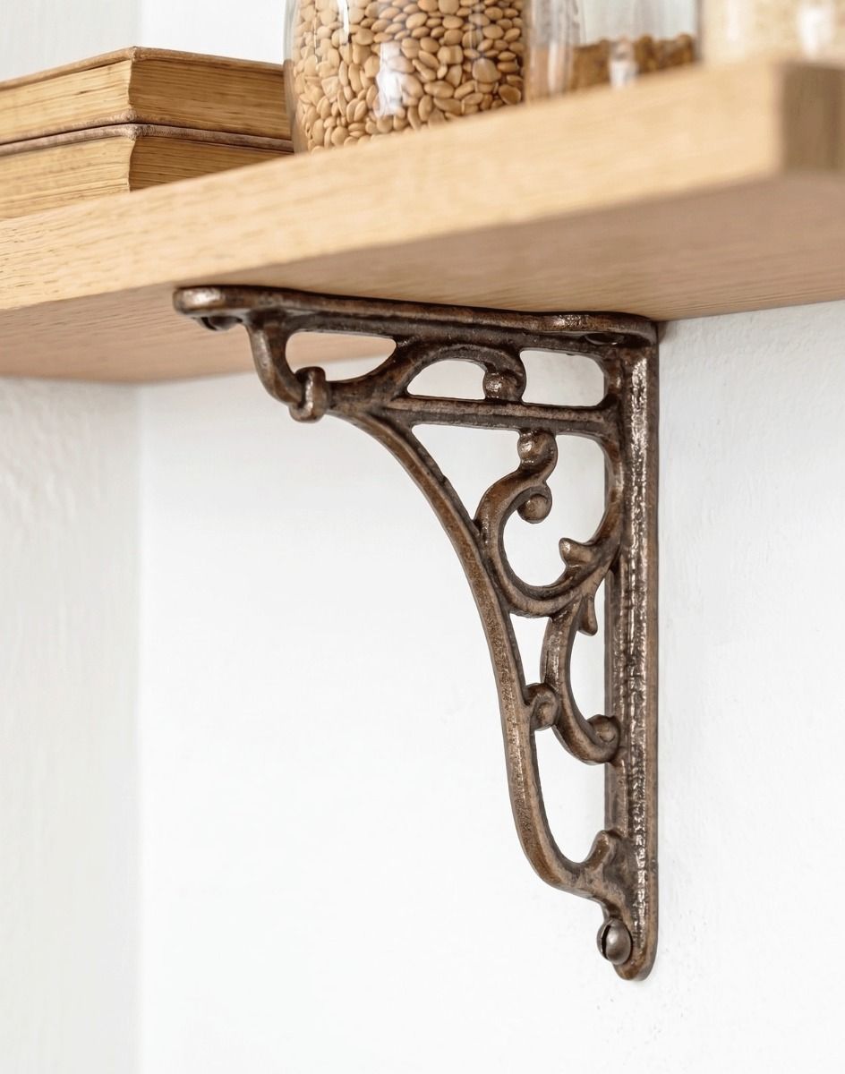 The 15 x 15cm Antique Iron "Vines" Wall Bracket Mounted on a White Coloured Living Room Wall - Digital Illustration 