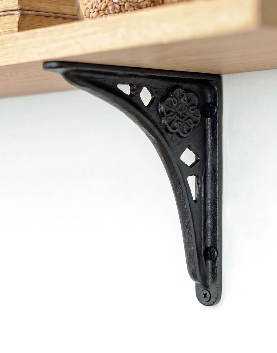 The 15 x 15cm Traditional Cast Iron Tudor Rose Shelf Bracket Mounted on a White Wall for a Wooden Shelf - Digital Illustration