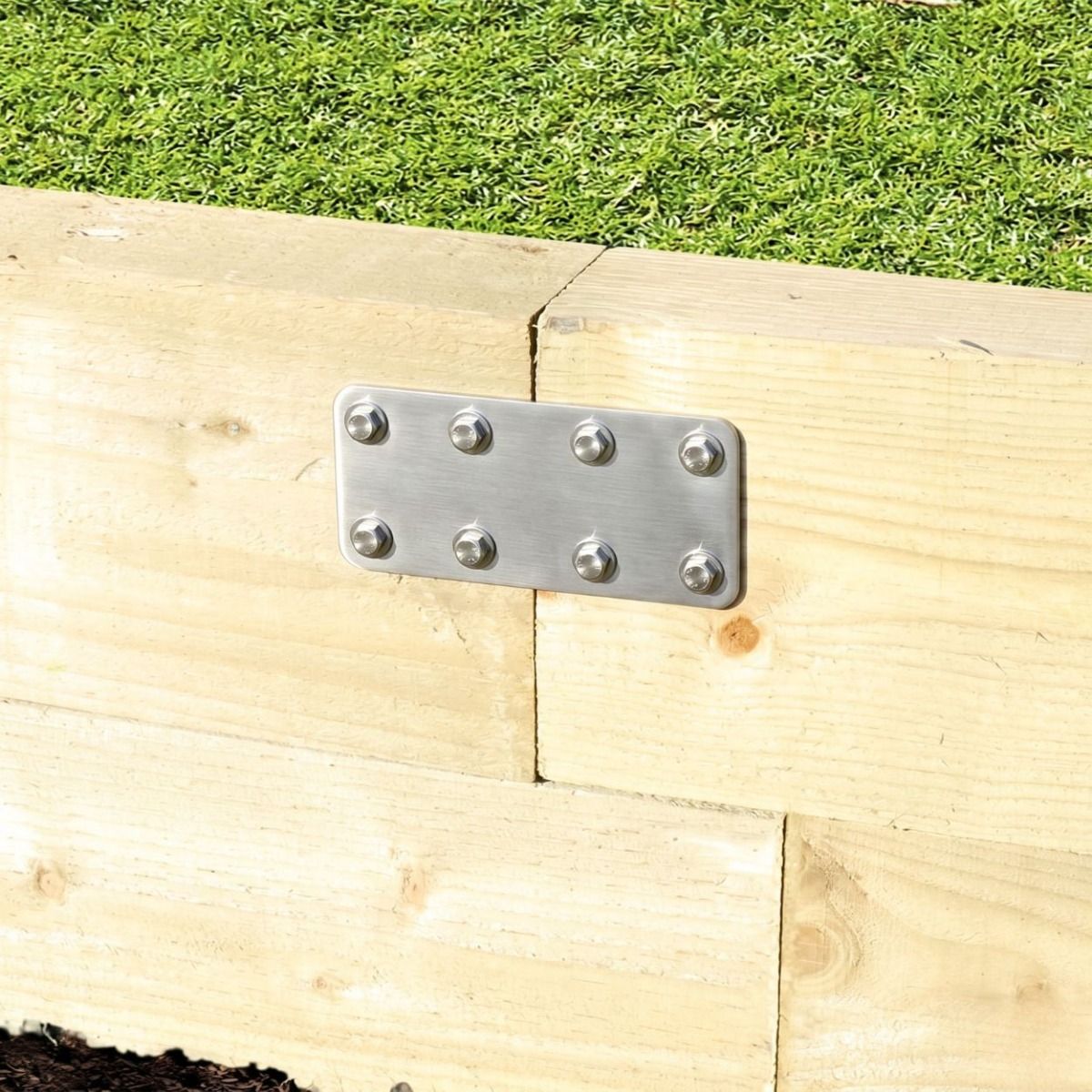 The 170mm Stainless Steel Railway Sleeper Straight Joining Plate Displayed Supporting the Join Between Large Wooden Sleepers 