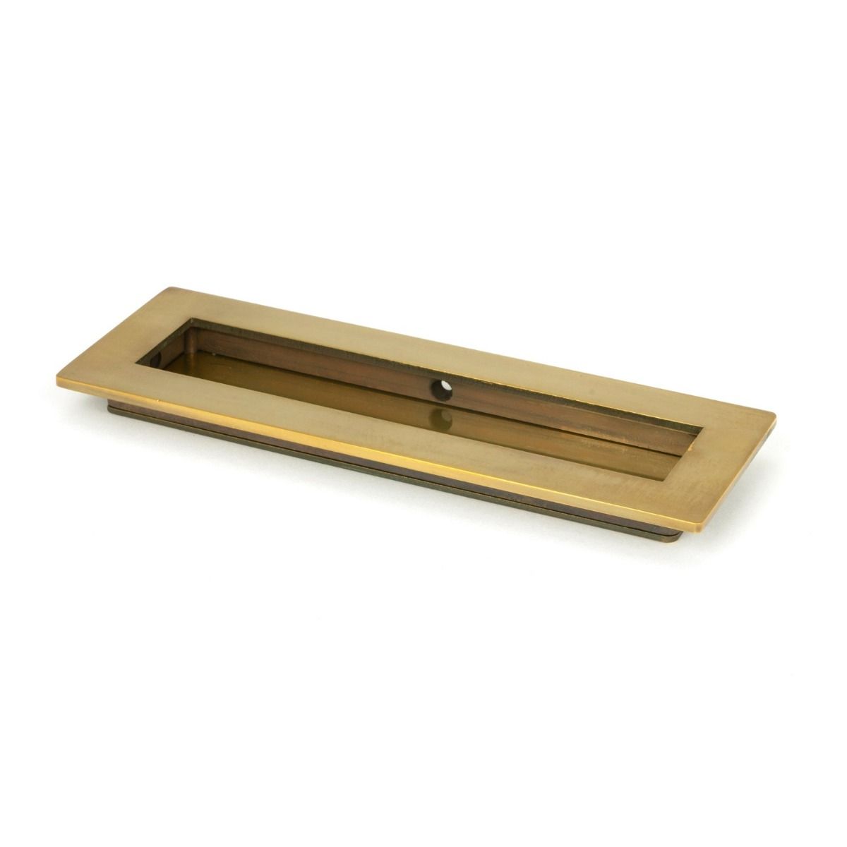 The 175mm Plain Rectangular Flush Pull Handle in Aged Brass Shown at an Angle on a White Background