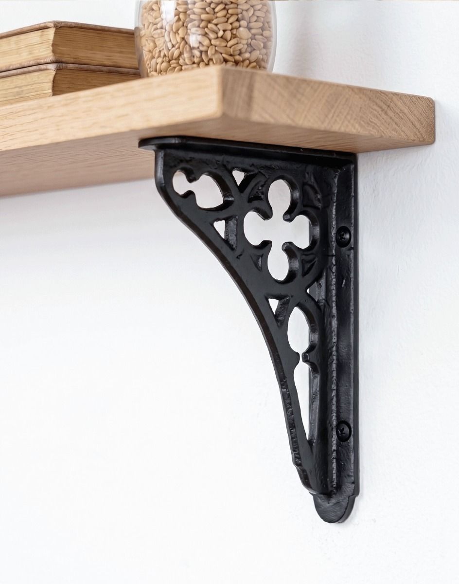 The 18 x 13cm Black Cast Iron Coalbrookdale Shelf Bracket Mounted on a Neutral Coloured Wall in a Modern Home being used as a Wall Bracket - Digital Illustration