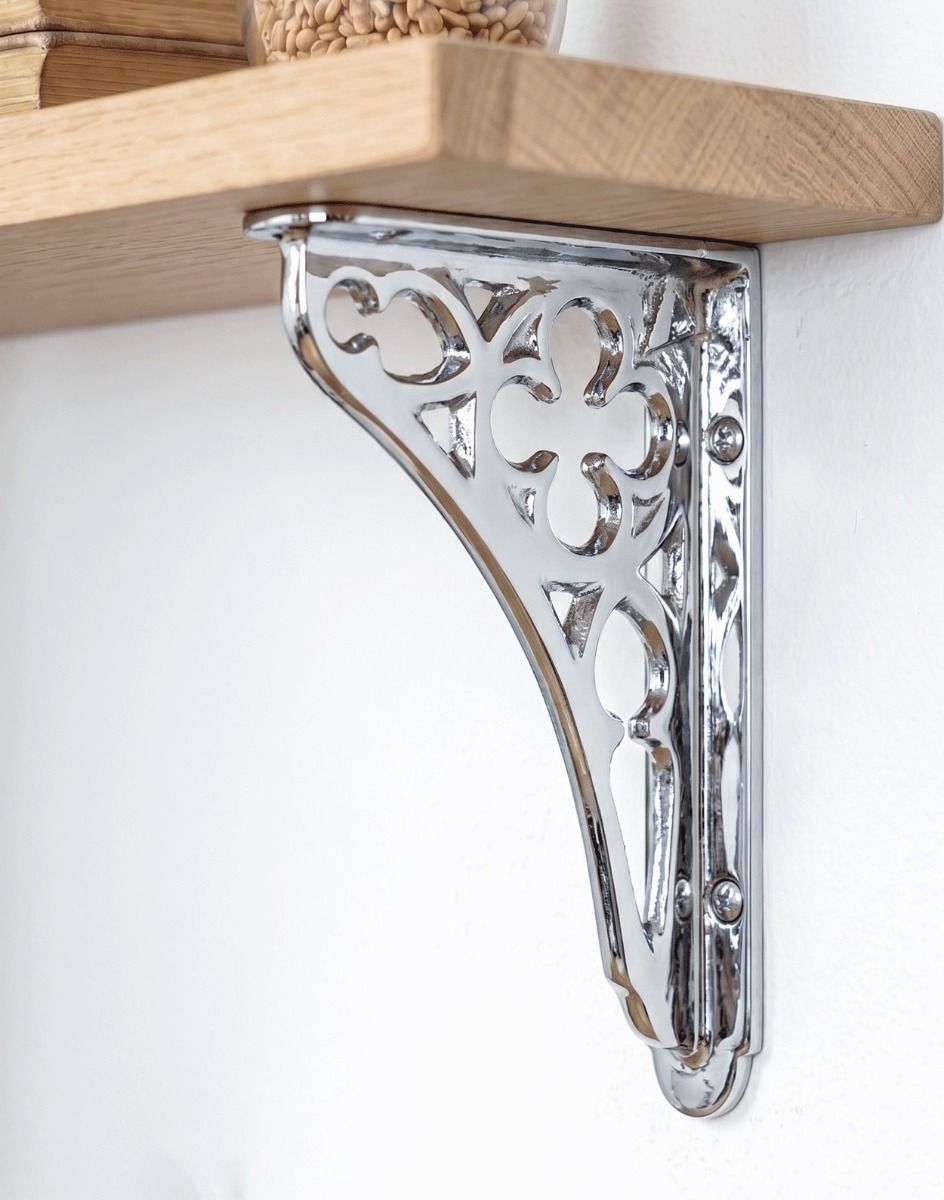 The 18 x 13cm Bright Chrome Coalbrookdale Shelf Bracket Mounted on a White Modern Home Interior Wall - Digital Illustration 