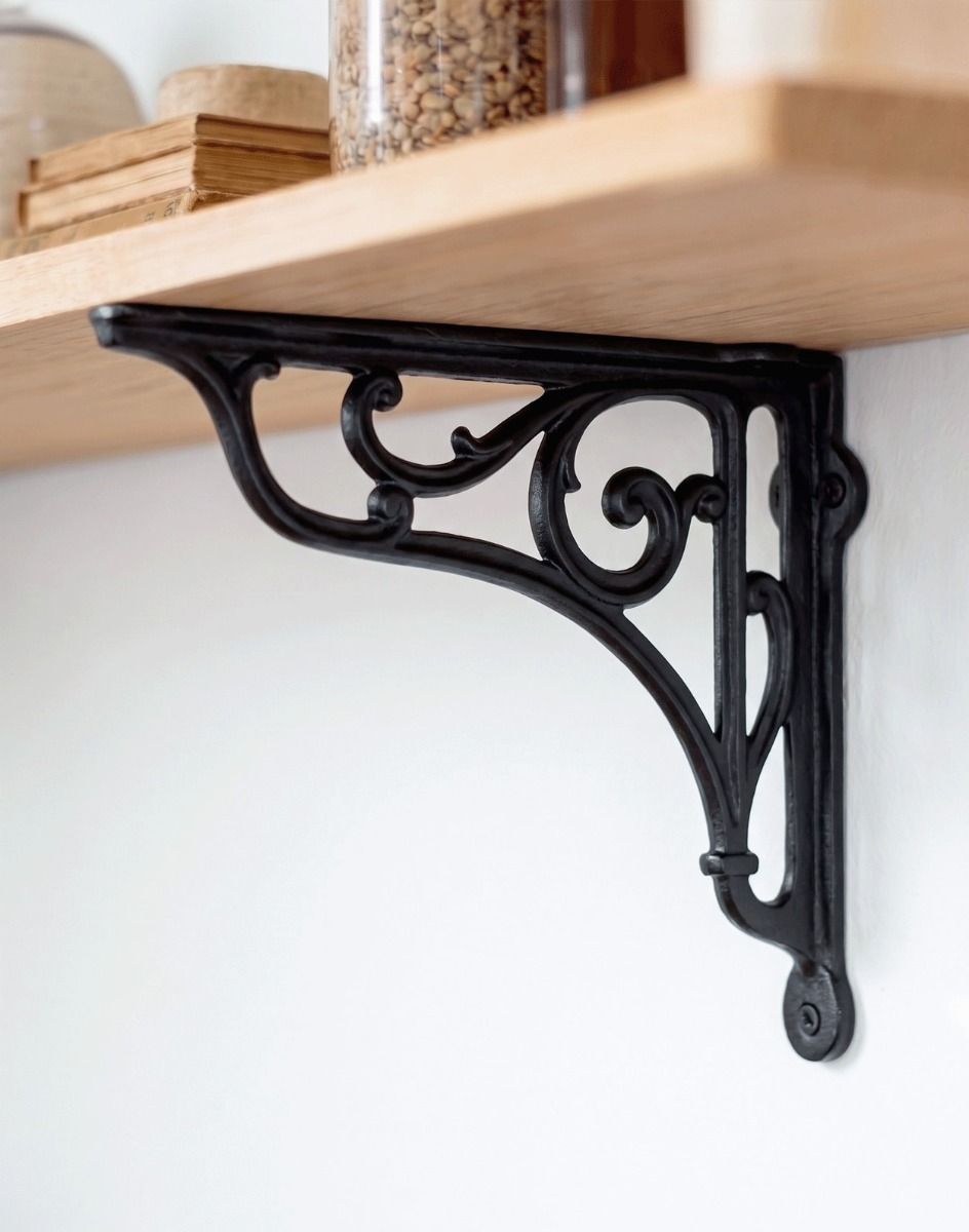 The 18 x 20cm Black Cast Iron Shelf Bracket with Scroll Mounted on a Modern White Interior Wall - Digital Illustration