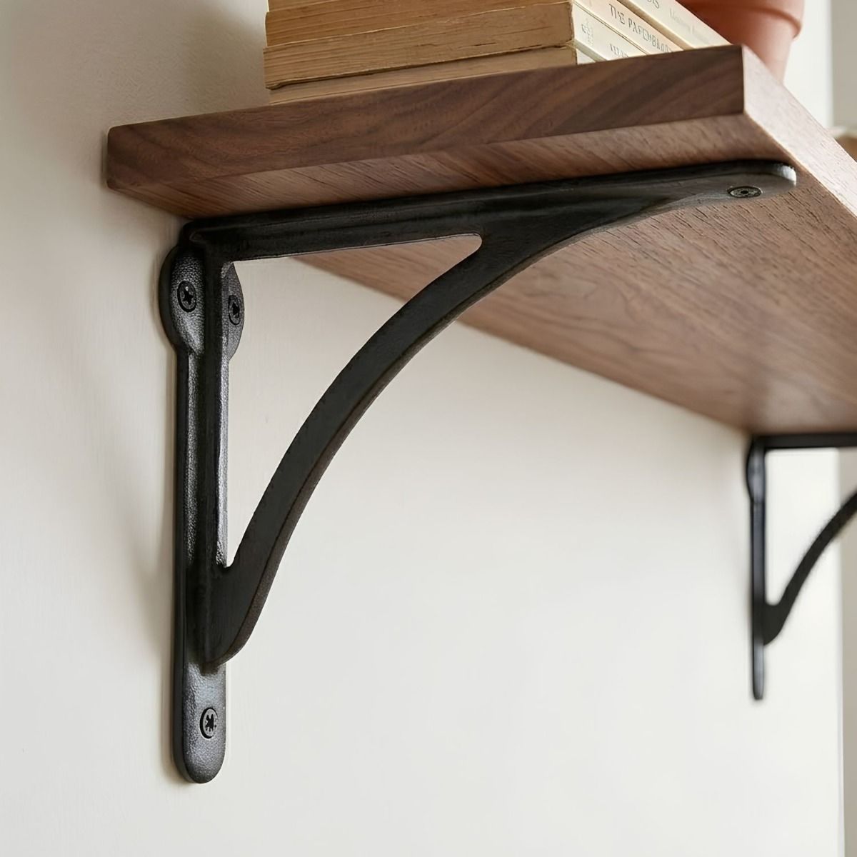The 18 x 25cm "Bowfell" Beeswax Curved Iron Shelf Bracket on a DIY Shelf in a Modern Home - Digital Illustration 