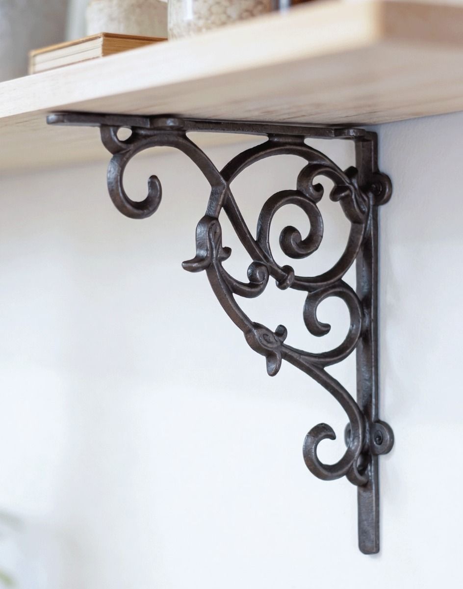 The 20 x 23cm Cast Iron Tulip Design Shelf Bracket Mounted on a Cream Coloured Living Room Wall - Digital Illustration