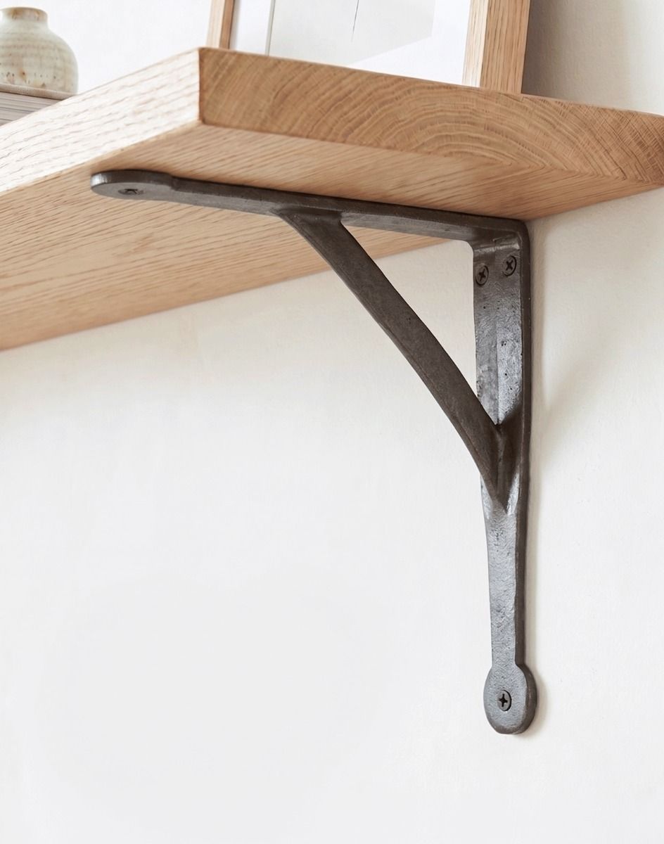 The 21.5 x 21.5cm Cast Iron Architectural Shelf Bracket Mounted on a Neutral Tone Interior Home Wall - Digital Illustration 