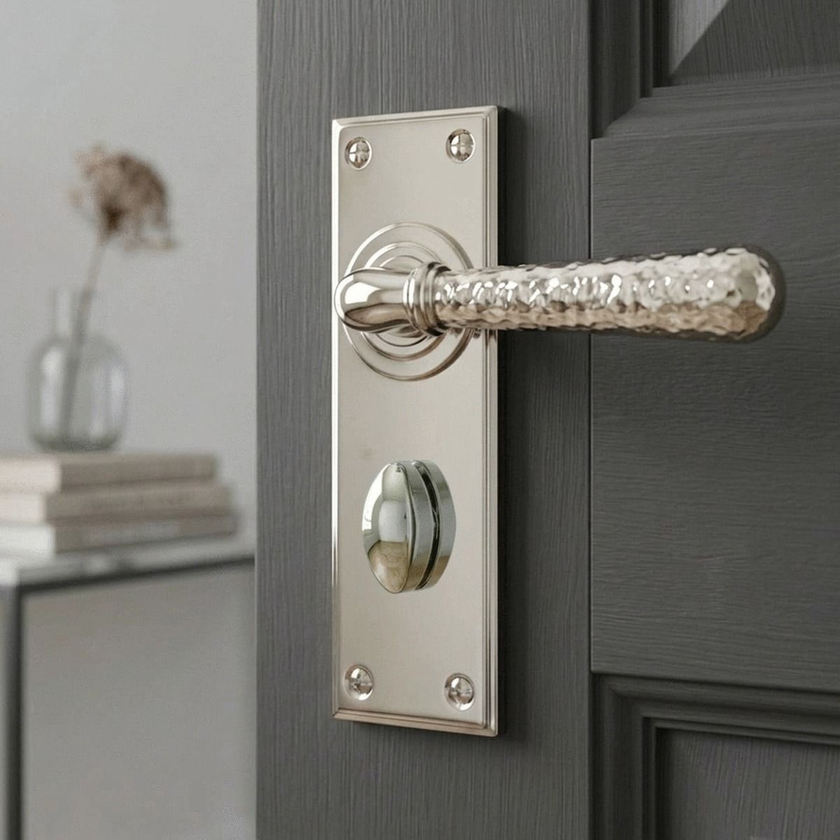 The "Amsden House" Hammered Polished Nickel Lever Bathroom Door Handle on an Ensuite Door with Thumbturn Lock - Digital Illustration 