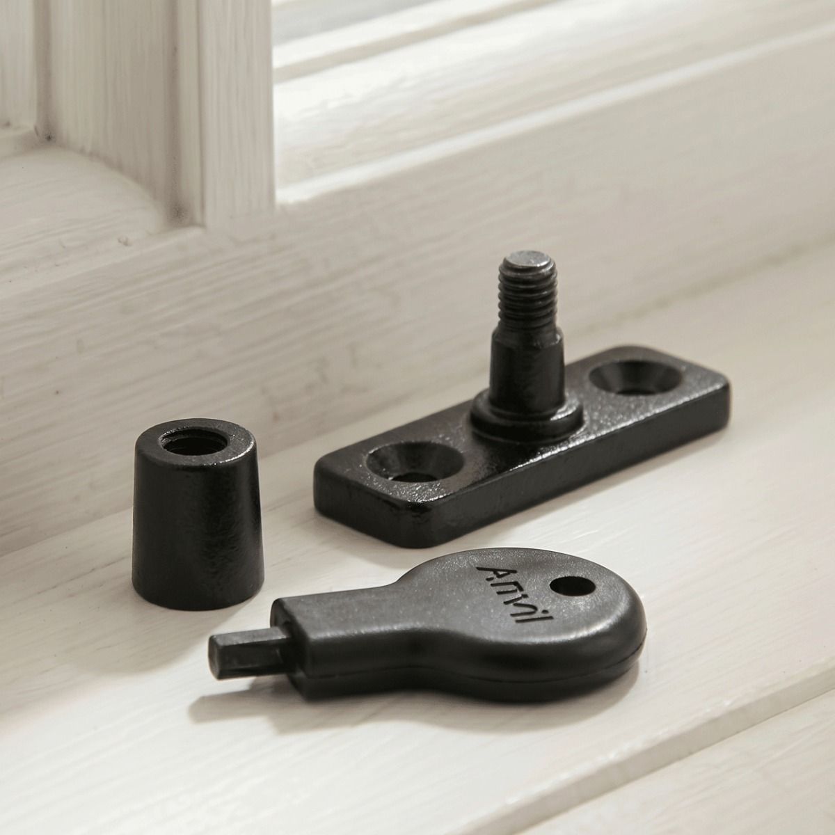 The "Bolsover" Iron Locking Stay Pin Mounted on a Classic White Window Frame in a Country Home - Digital Illustration