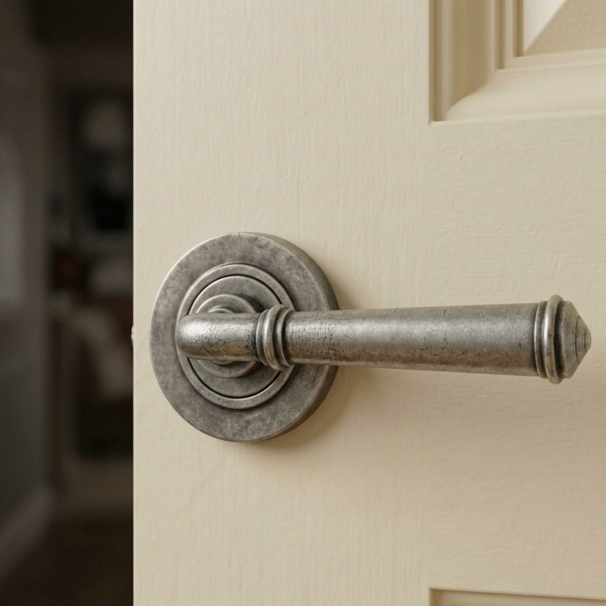 The "Bridgerton" Rounded Pewter Lever Door Handle on Rose Shown Up Close on a Cream Coloured Door - Digital Illustration