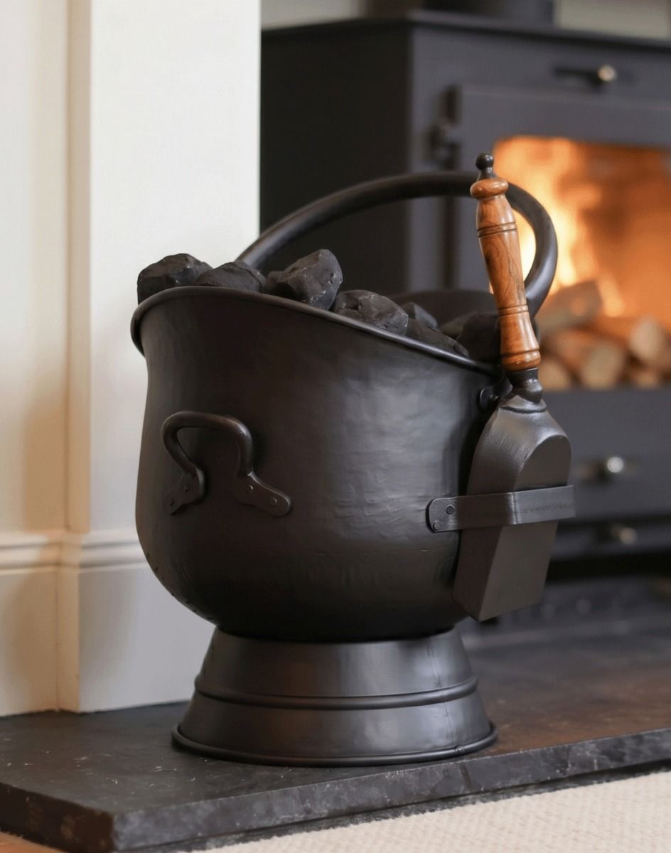 The "Brindleton" Coal Scuttles with Shovels Displayed in Front of a Lit Log Burner - Digital Illustration