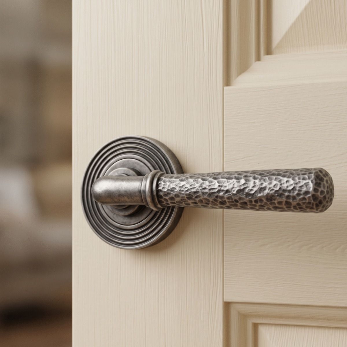 The "Clarissa" Pewter Hammered Lever Door Handle on Beehive Rose Mounted on a White Door in a Modern Home - Digital Illustration