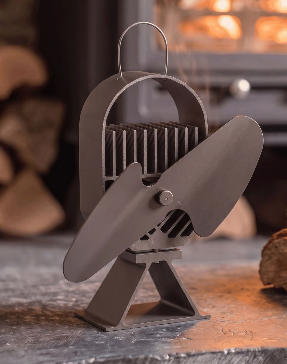 The 22cm Black "Air Deco" Eco Wood Stove Fan Displayed in Front of a Fireplace in a Modern Home - Digital Illustration 