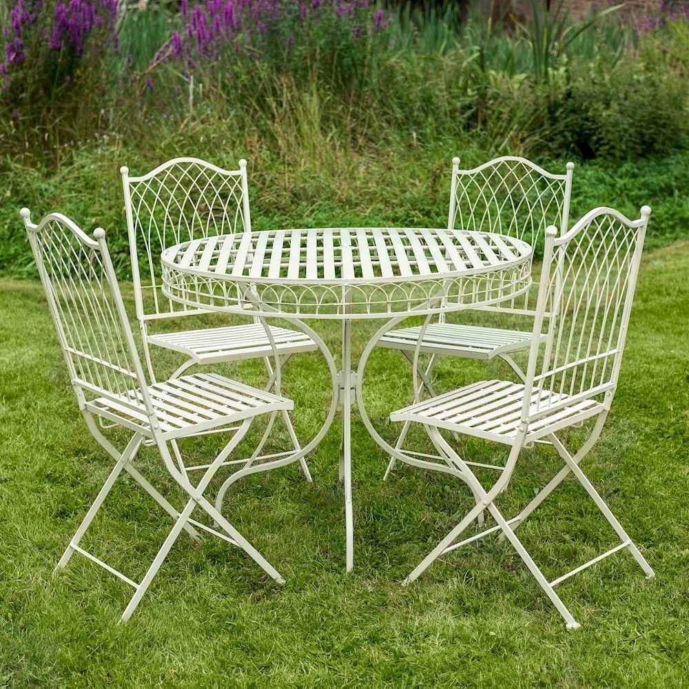 The "Easton" Cream 4-Seater Garden Dining Set in Situ on the Lawn in a Garden 