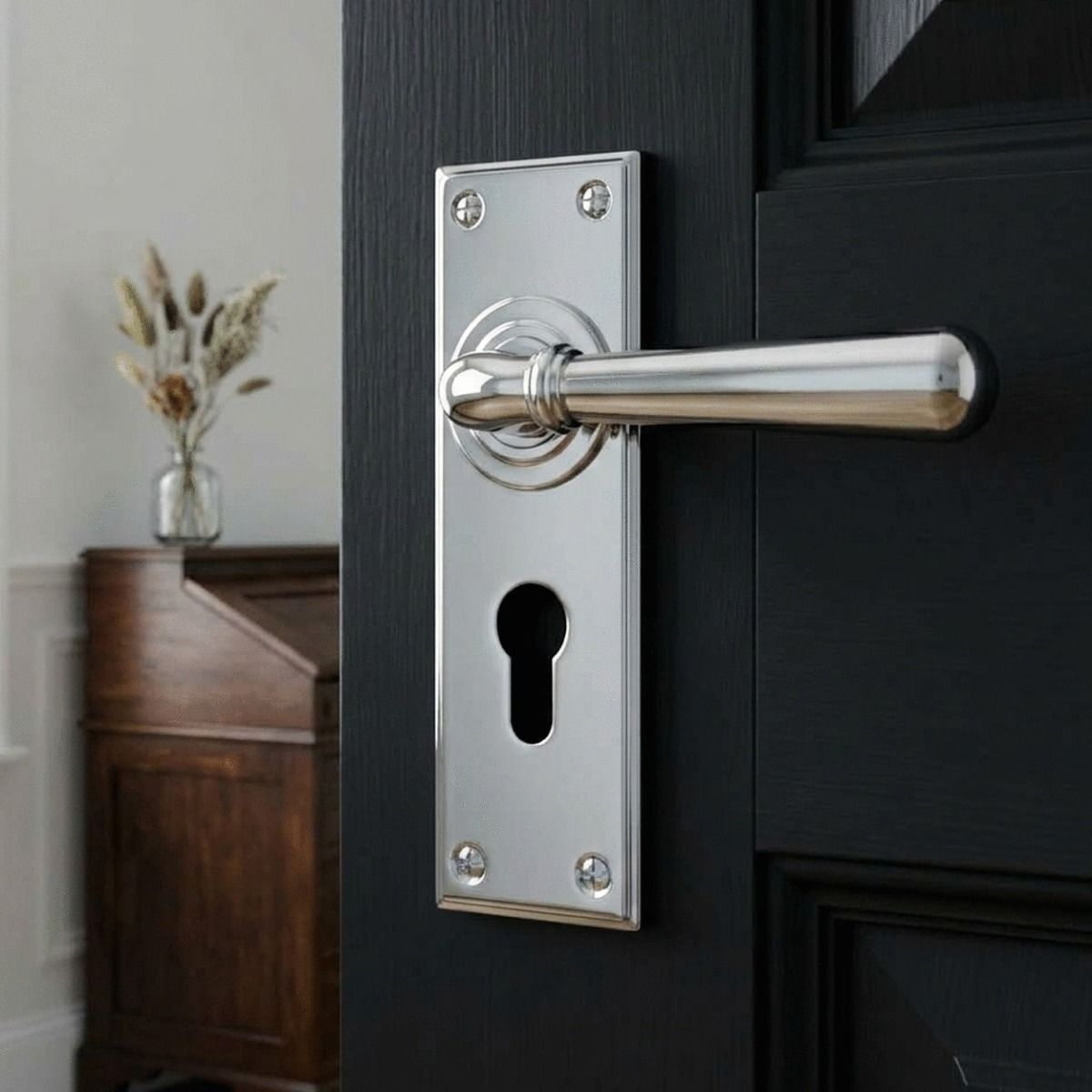The "Emerson" Bright Chrome Euro Lever Door Handle in a Period Home on a Black Door - Digital Illustration