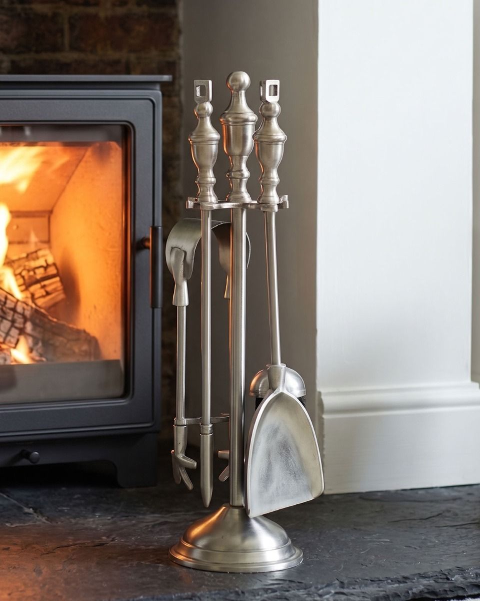 The "Grecian" Pewter Fireside Companion Set with a Wood Burner Stove Behind - Digital Illustration