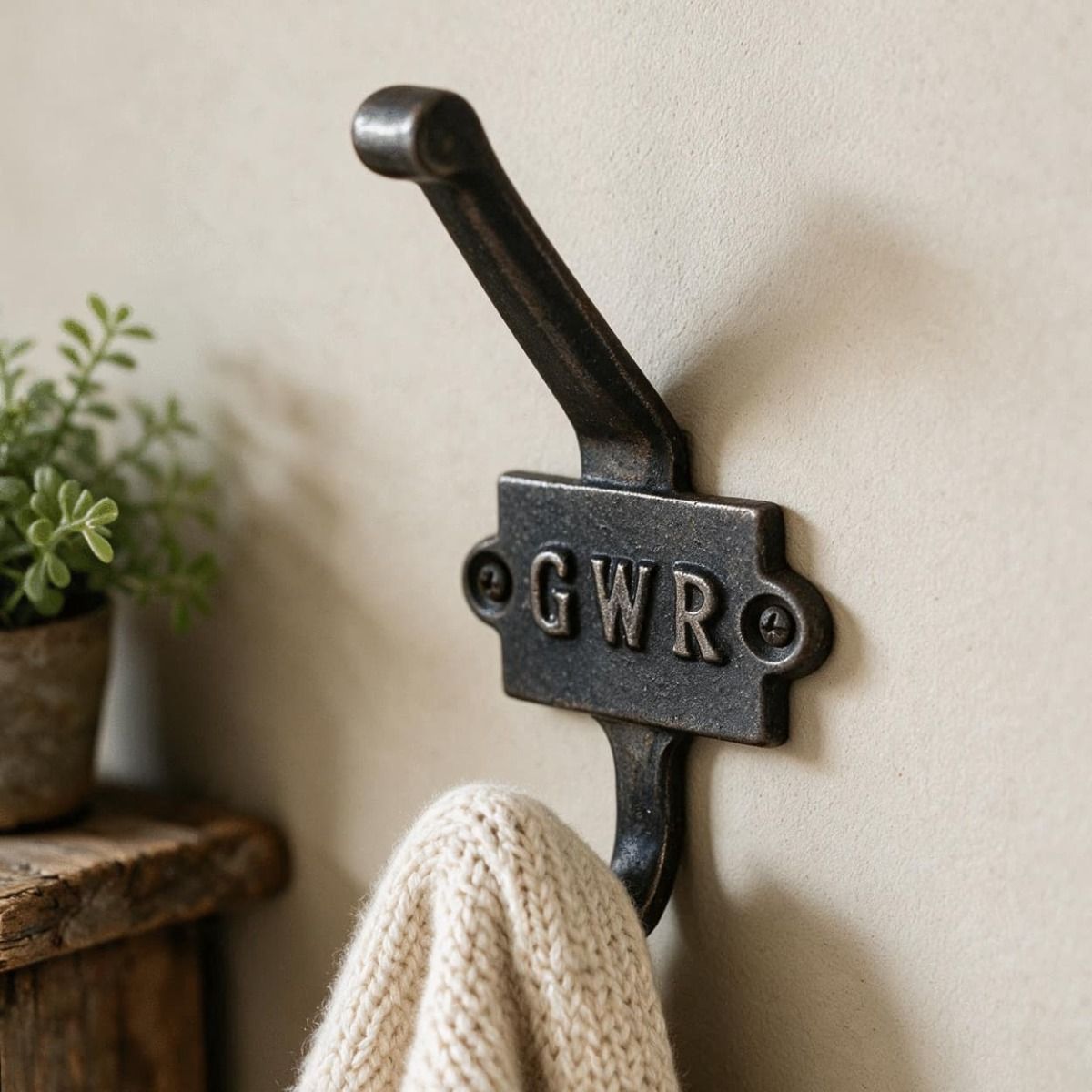 The "GWR" Iron Coat Hook on a Magnolia Coloured Wall in a Country Home - Digital Illustration