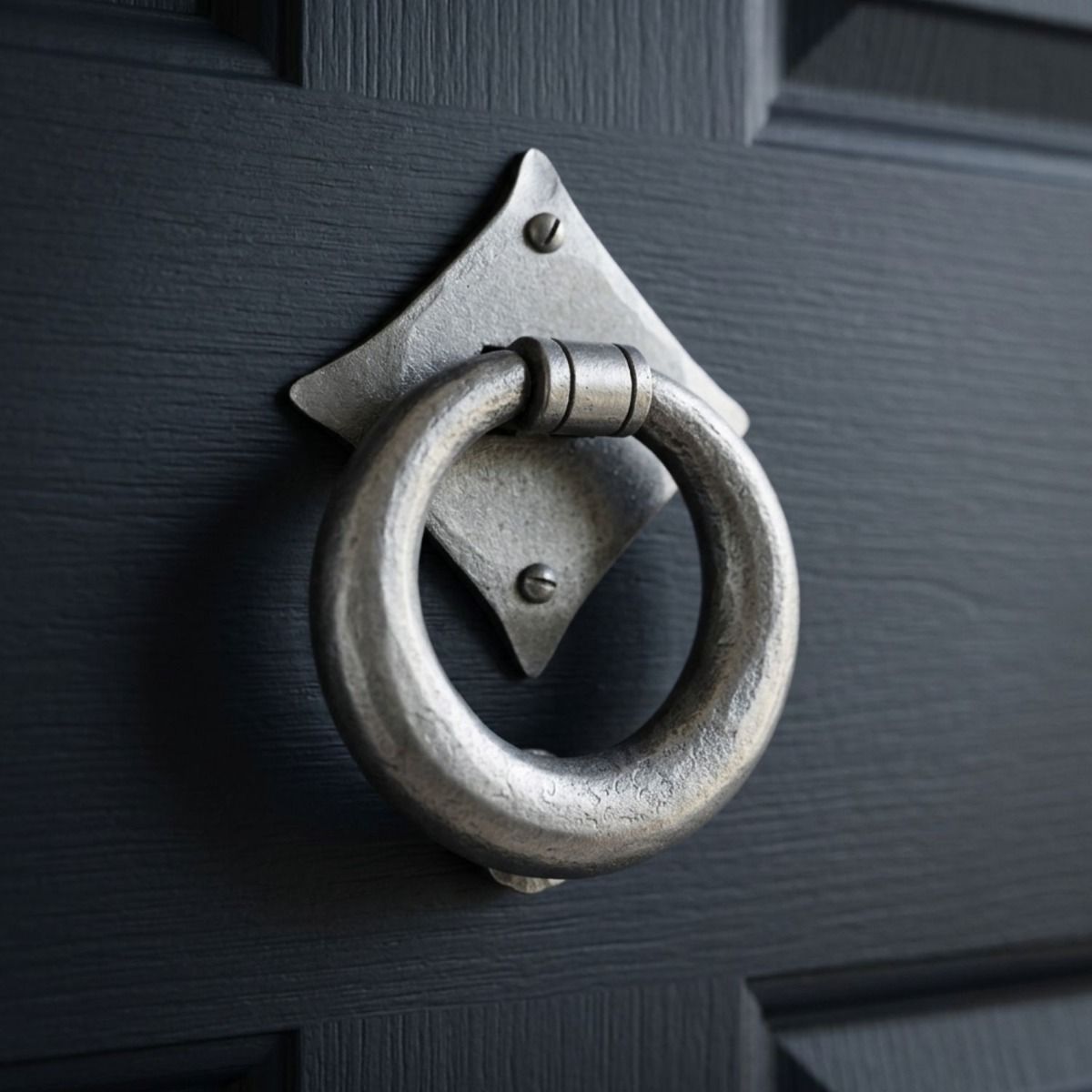 The "Lorien" Pewter Ring Door Knocker  Fitted onto a Navy Blue Front Door - Digital Illustration