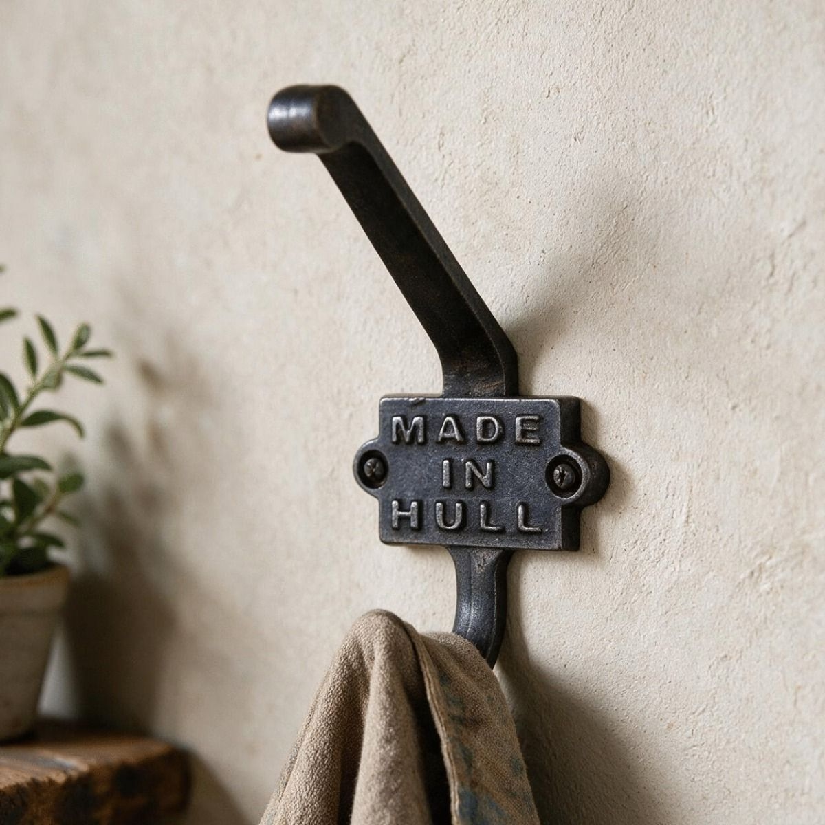 The "Made in Hull" Iron Coat Hook on a Cream Coloured wall in a Traditional Home - Digital Illustration