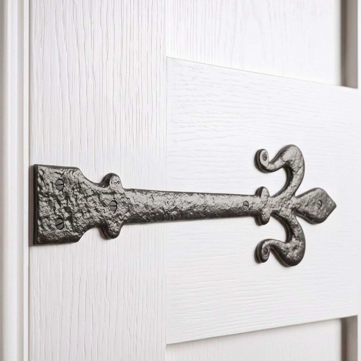 The "Middlemore" Fleur-De-Lys Cast Iron Hinge Shown Close up on a White Painted Timber Door - Digital Illustration 