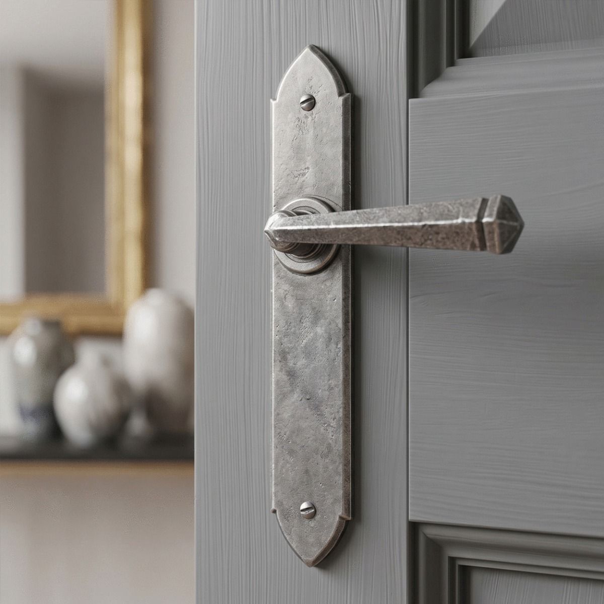 The "Orelia" Pewter Gothic Latch Lever Set  on a Light Grey Door in a Modern Living Room - Digital Illustration