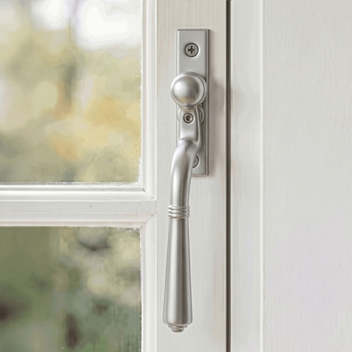 The "Regency" Satin Chrome Teardrop Espagnolette Window Fastener Fitted on a White Painted Window Frame - Digital Illustration