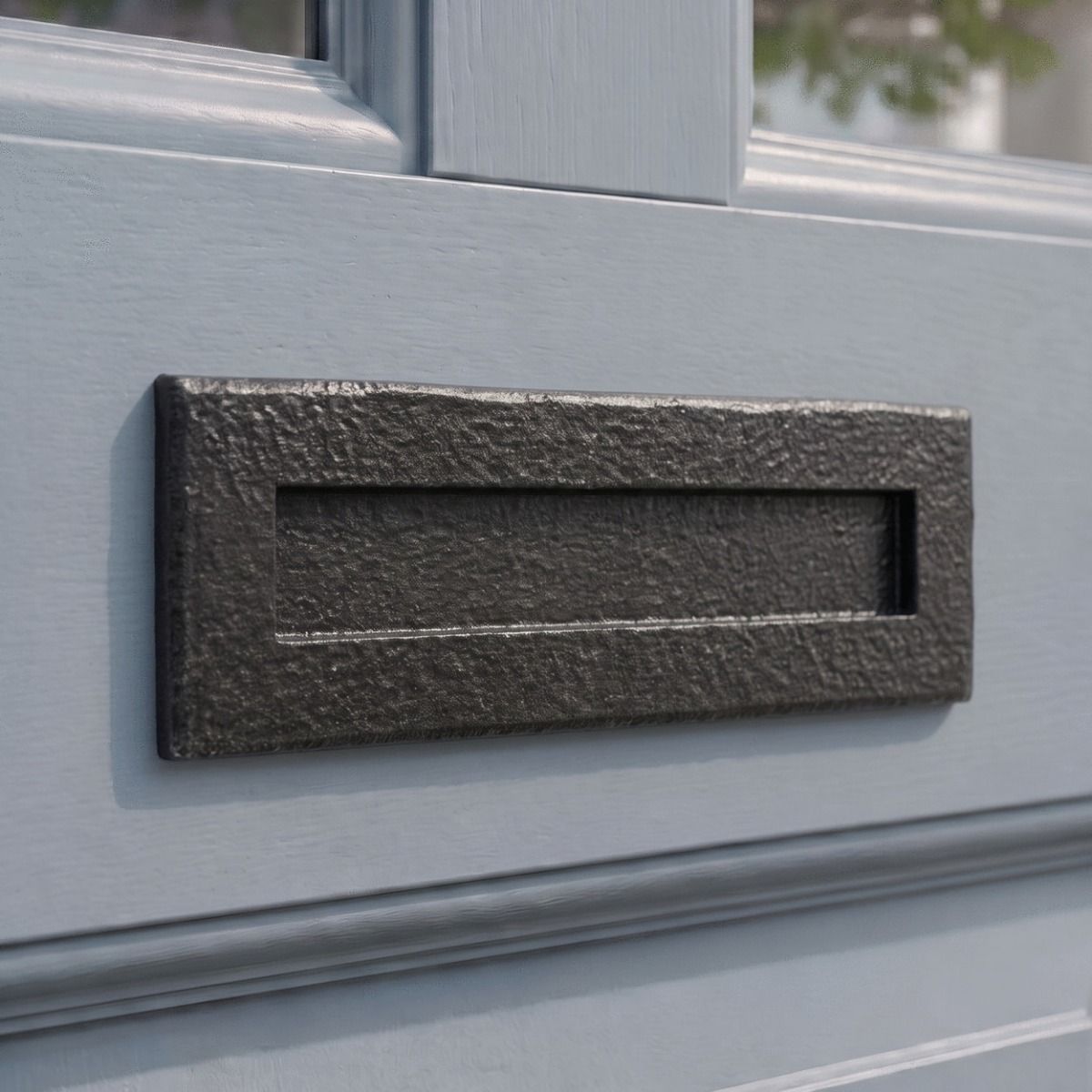 The "Reinshaw Avenue" Blacksmith Style Letter Plate on a Light Grey Door on a Traditional Home - Digital Illustration