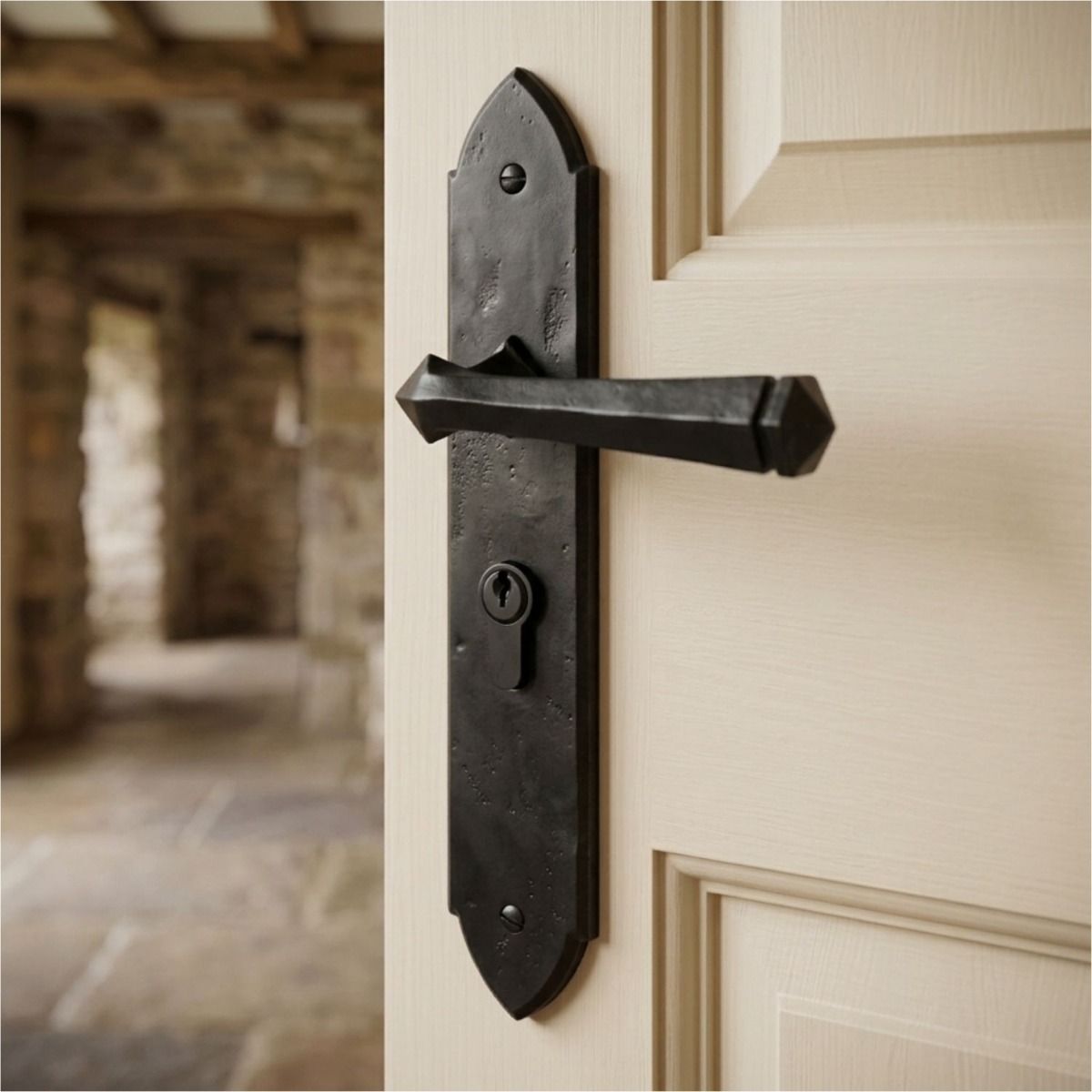 The "Rosa" Beeswax Gothic Lever Euro Lock Set on a white Door in a Cottage Barn - Digital Illustration 