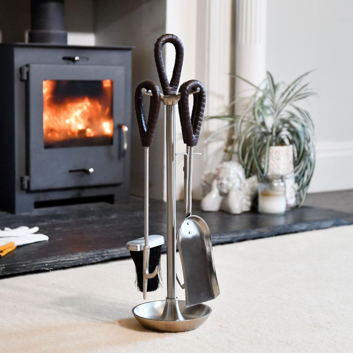 The "Tundra" Pewter Companion Set With Leather Handles in Front of a Modern Fireplace  - Digital Illustration 