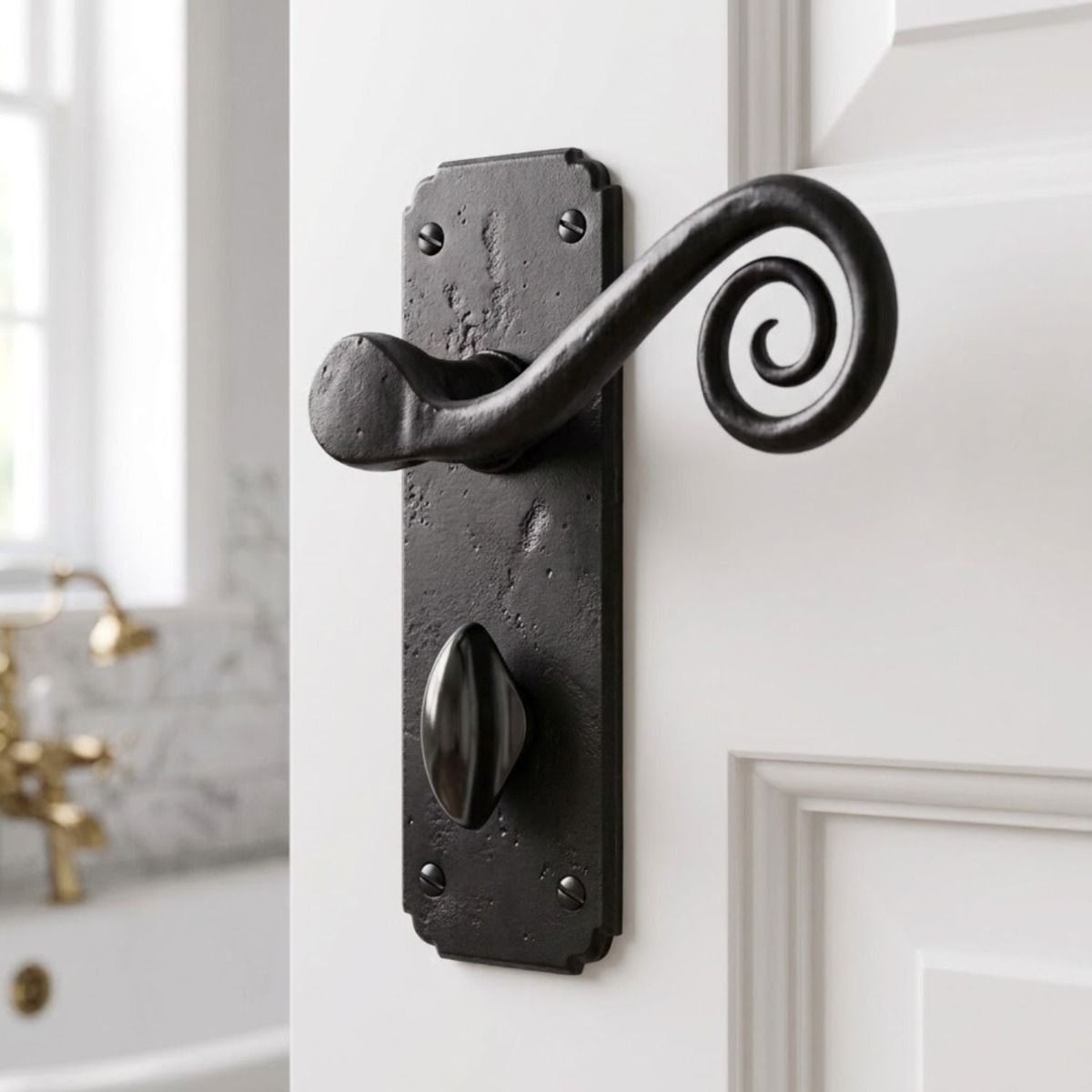 The "Vervet" Beeswax Monkey tail Lever Bathroom Set Shown on a Well Lit White Bathroom Door - Digital Illustration