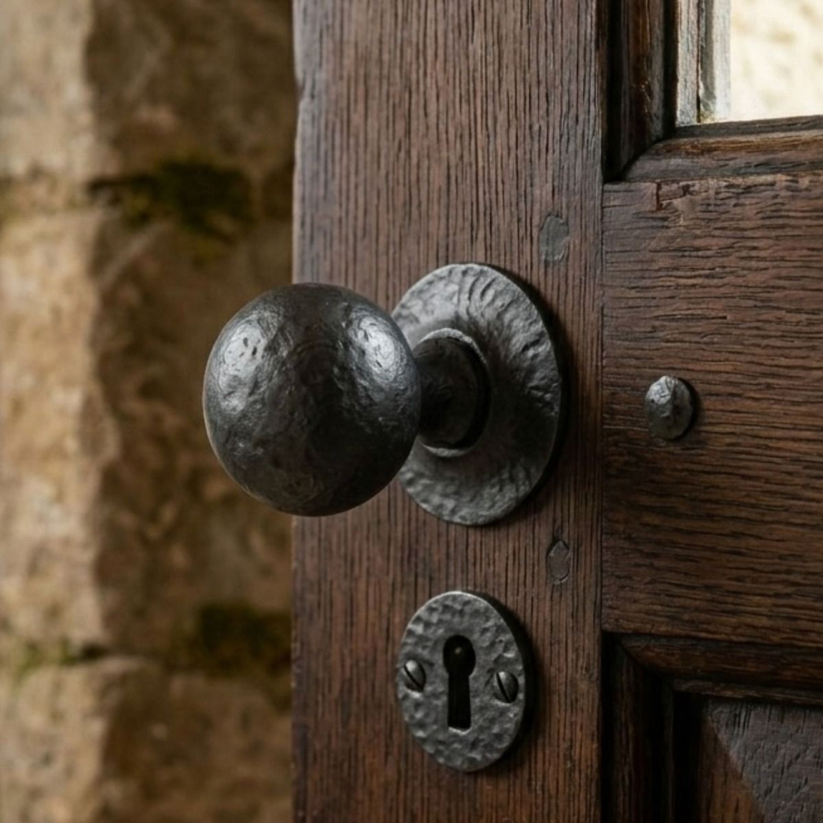 The "Washington" Beeswax Ball Mortice or Rim Knob Set with Escutcheons on a Dark Brown Antique Door in a Country Home - Digital Illustration