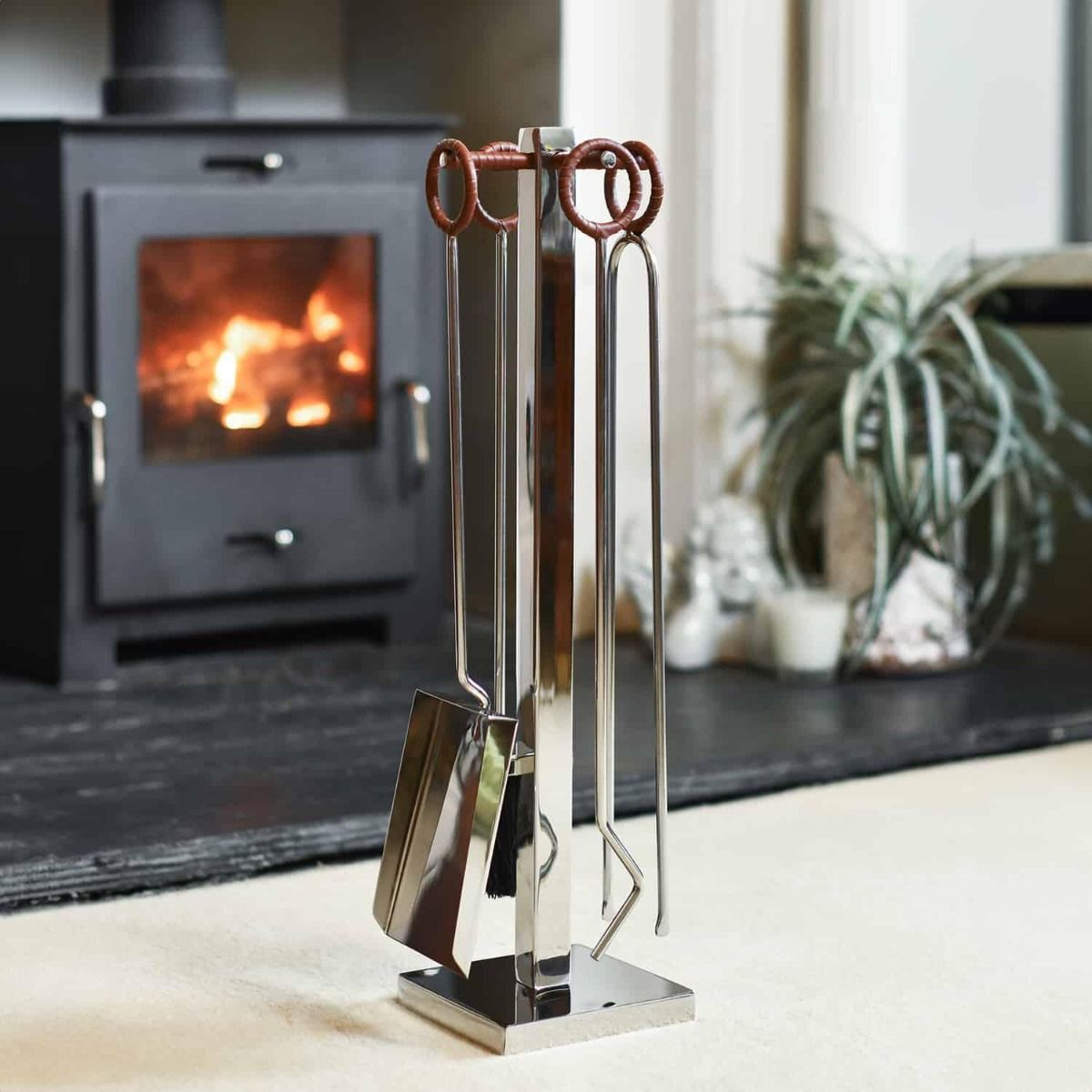 The "Woodbridge" Stainless Steel and Leather Circular Companion Set with a Wood Burner Stove Behind - Digital Illustration