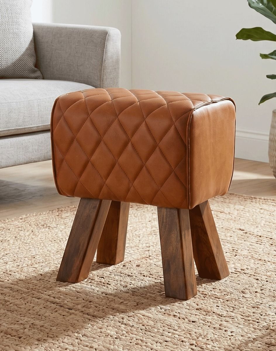 The "Yale" Mango Wood & Tan Leather Stool on a Beige Rug next to a Grey Living Room Sofa - Digital Illustration