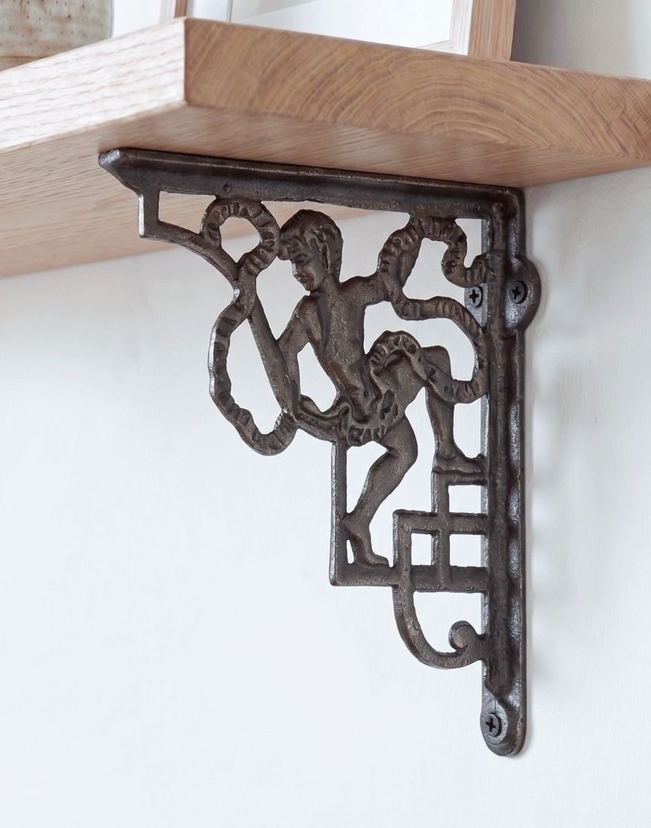 The 24 x 20cm Cherub Iron Shelf Bracket Shown Supporting a Wooden Shelf as Wall Hanger in a Modern Home - Digital Illustration 