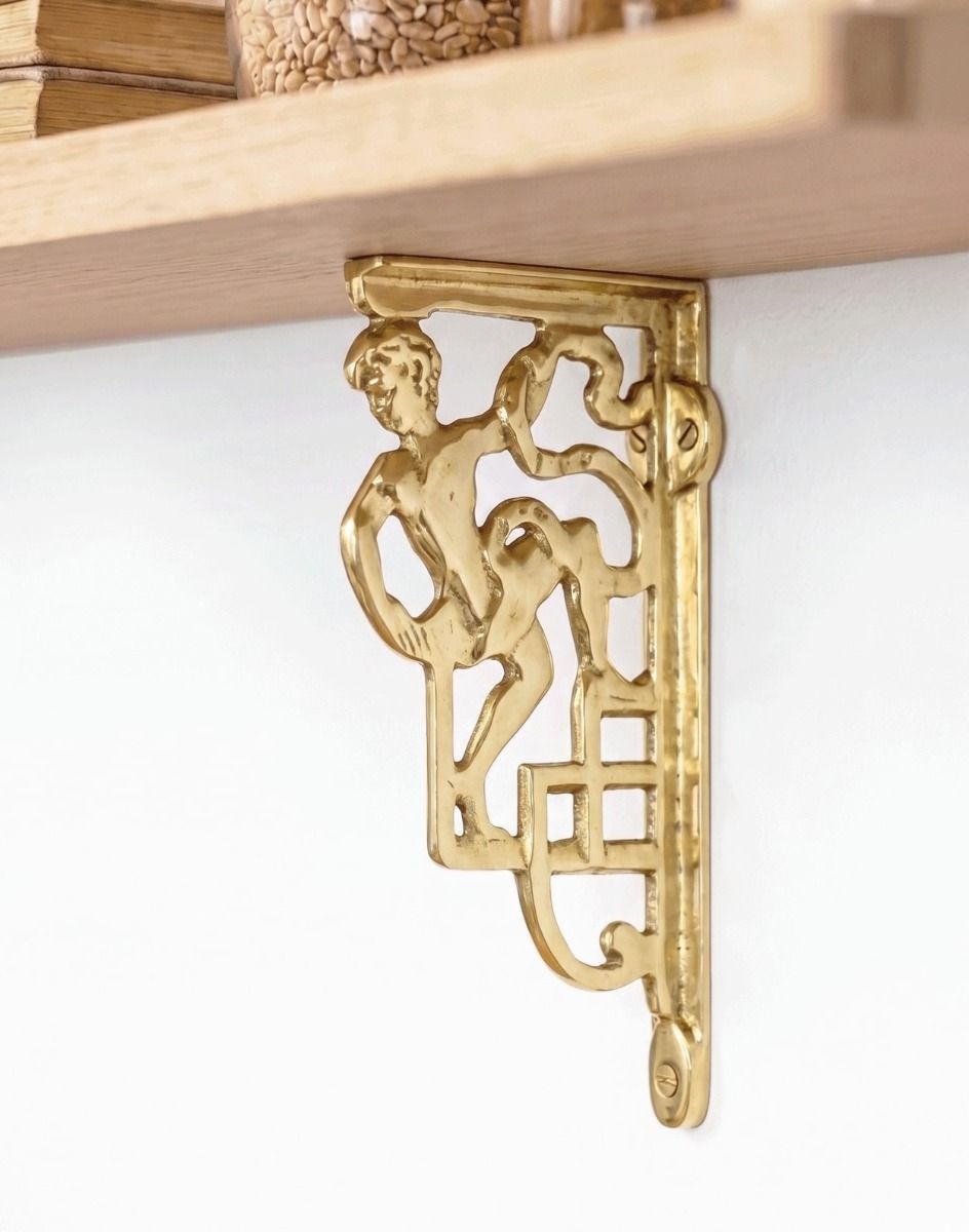 The 25 x 12cm Polished Brass Roman Man Design Bracket Mounted on a Cream Coloured Living Room Wall - Digital Illustration 