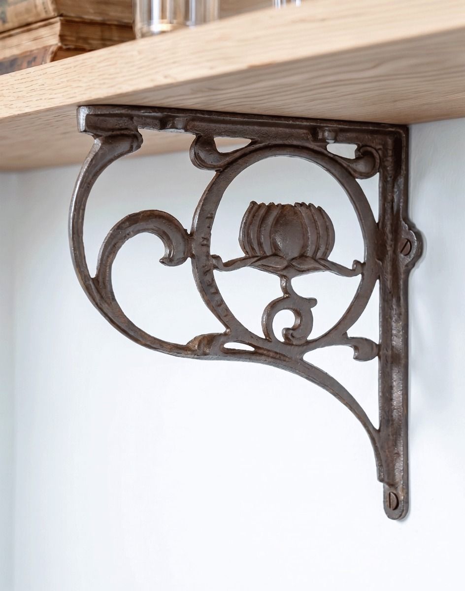 The 25 x 23cm "Lotus Flower" Iron Shelf Bracket Mounted on a White Kitchen Wall in a Contemporary Home - Digital Illustration 