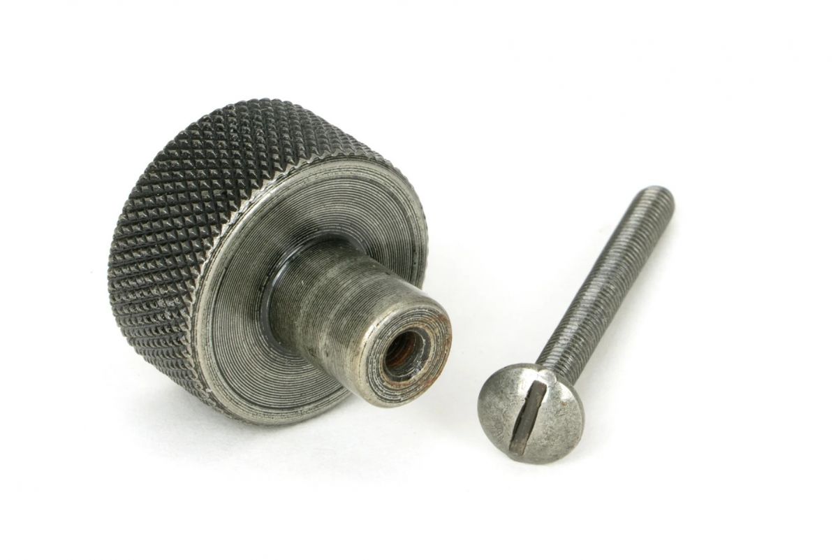 The 25mm "Vesper" Knurled Edge Cabinet Knob in Pewter Displayed on a White Background Shown from Behind with the Screw