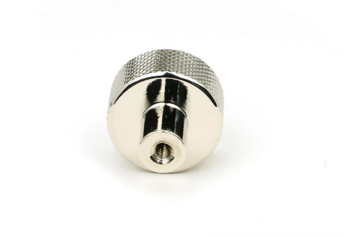 The 25mm "Vesper" Knurled Edge Cabinet Knob in Polished Nickel Displayed on a White Background Shown from Behind