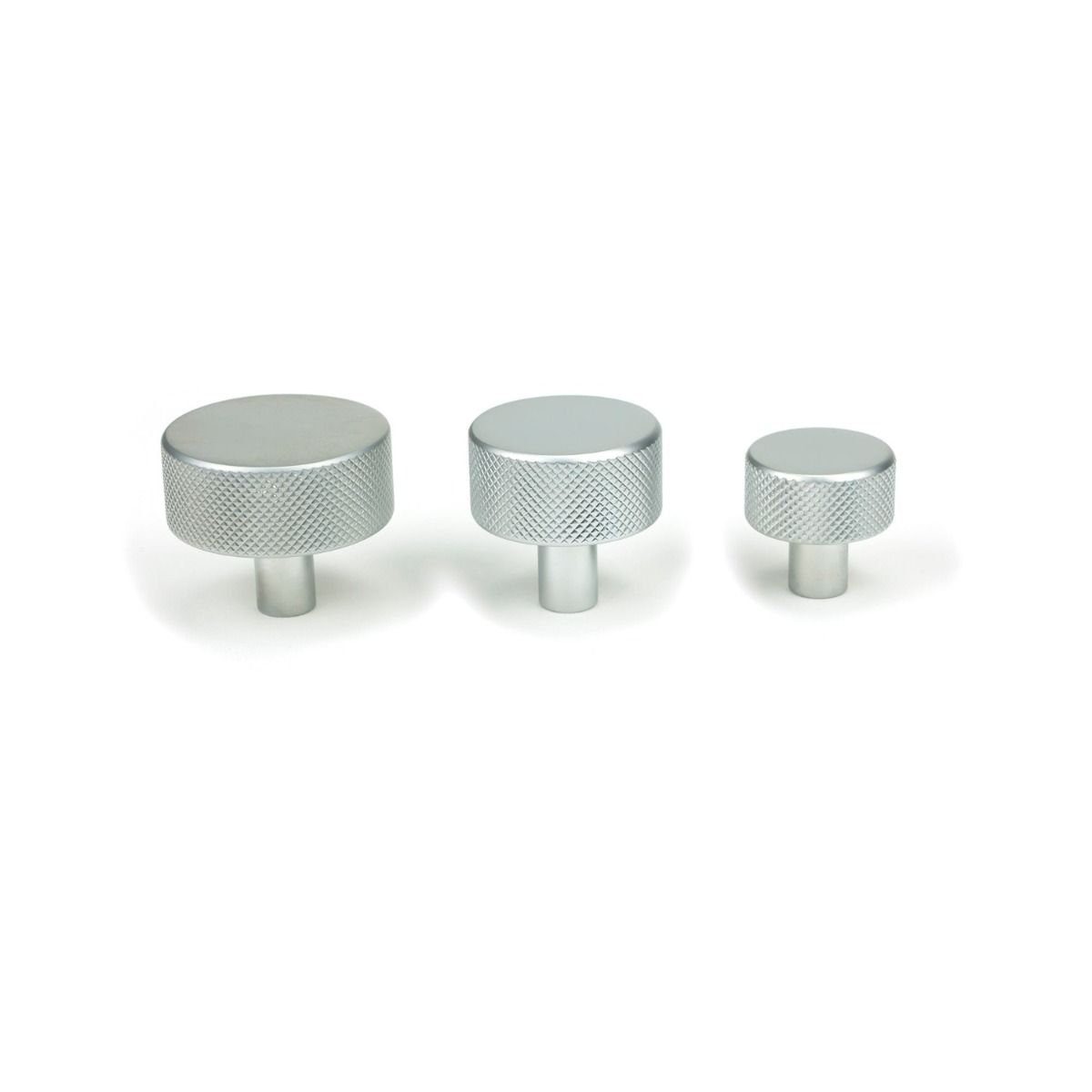 The 25mm Knurled Cabinet Knob (No Rose) in Satin Chrome Alongside Different Sizes