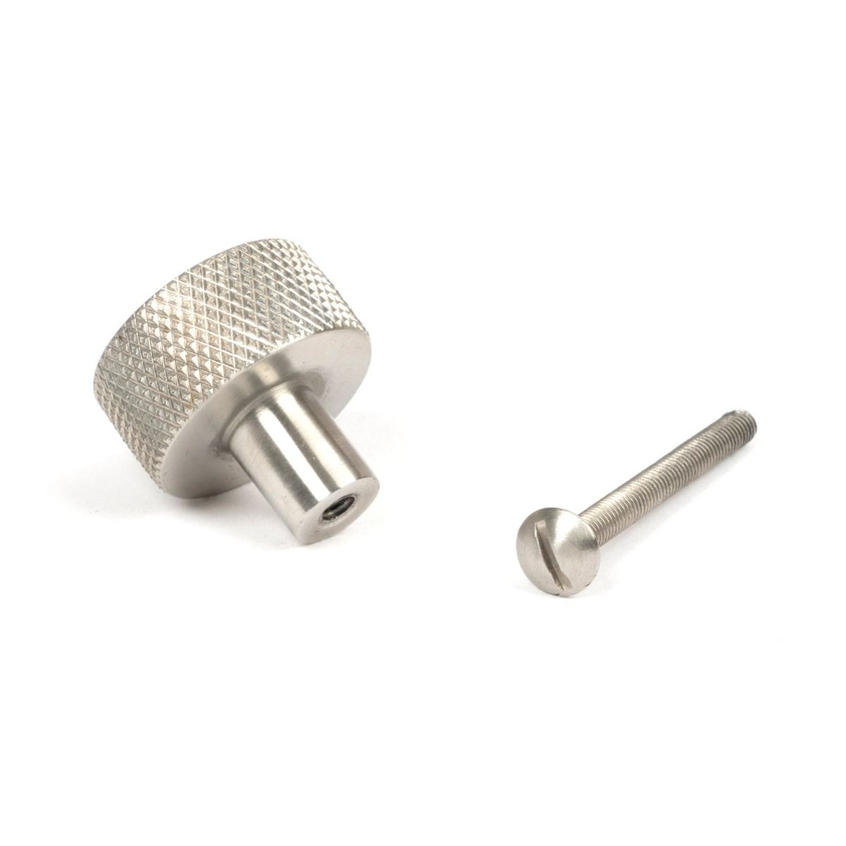 The 25mm Knurled Cabinet Knob (No Rose) in Satin Stainless Steel Shown with Fitting Bolt on a White Background
