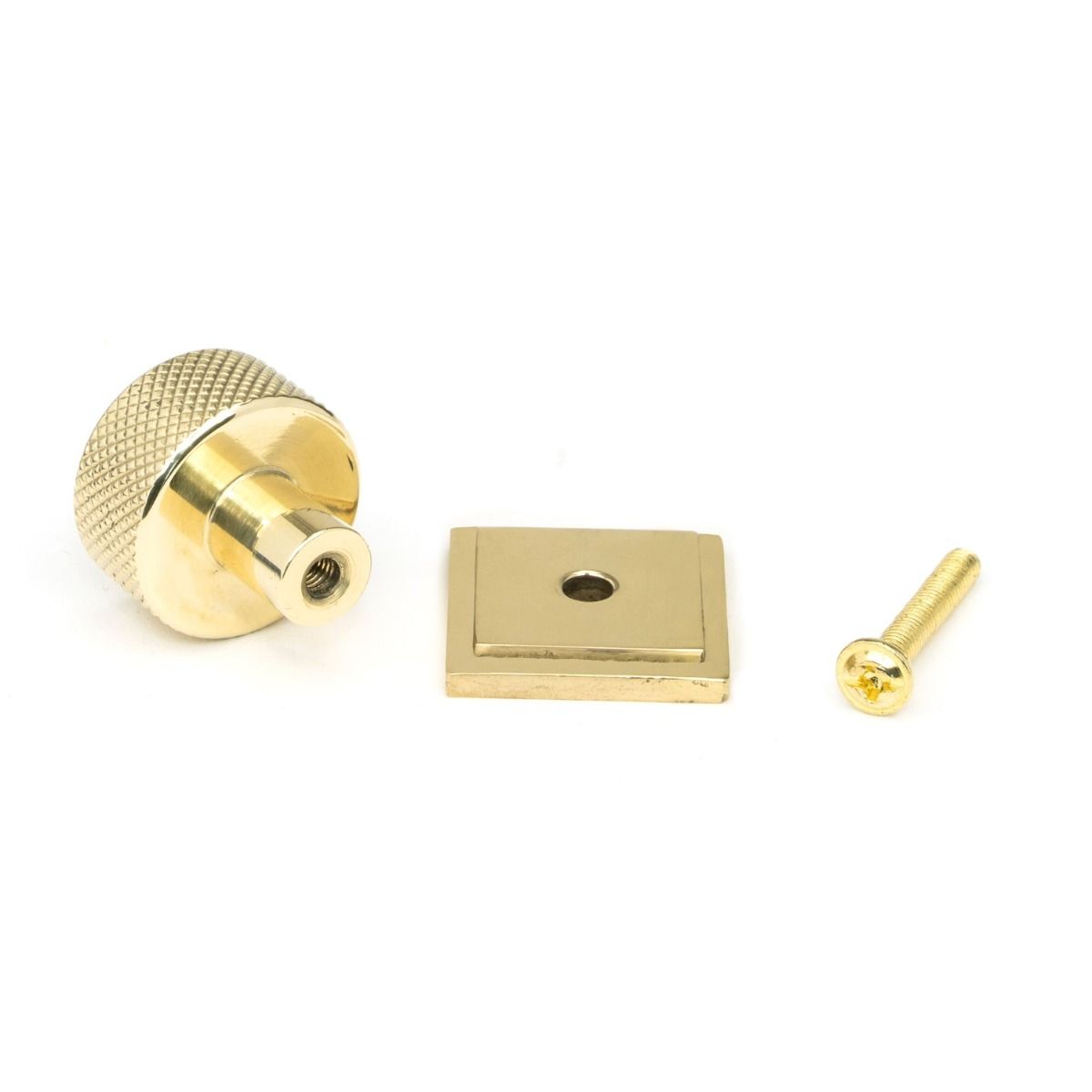 The 25mm Knurled Cabinet Knob on a Square Rose in Polished Brass with Fitting Bolt on a White Background 