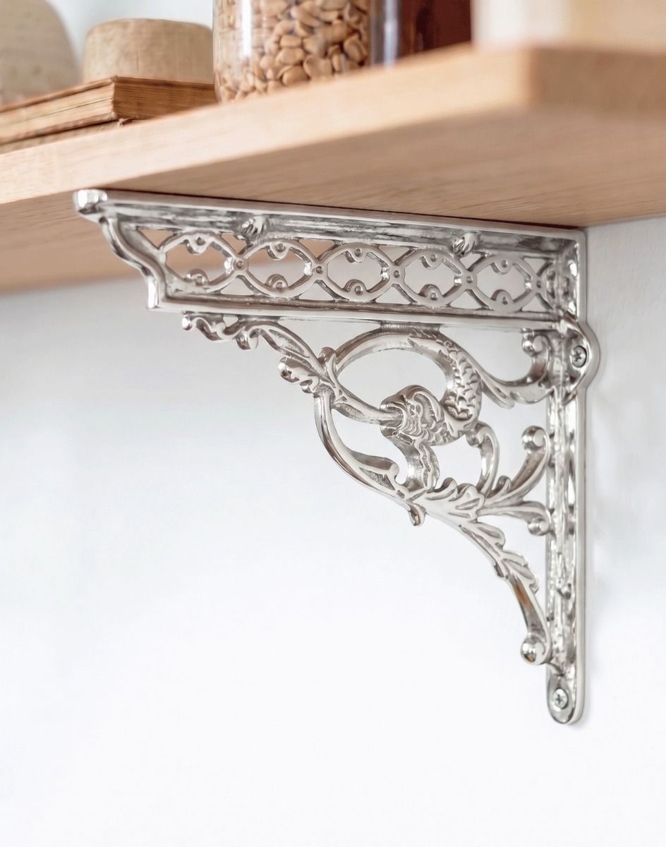 The 29cm x 33cm Serpent Design Chrome Wall Bracket Attached to a Wooden DIY Shelf on a White Coloured Wall - Digital Illustration 