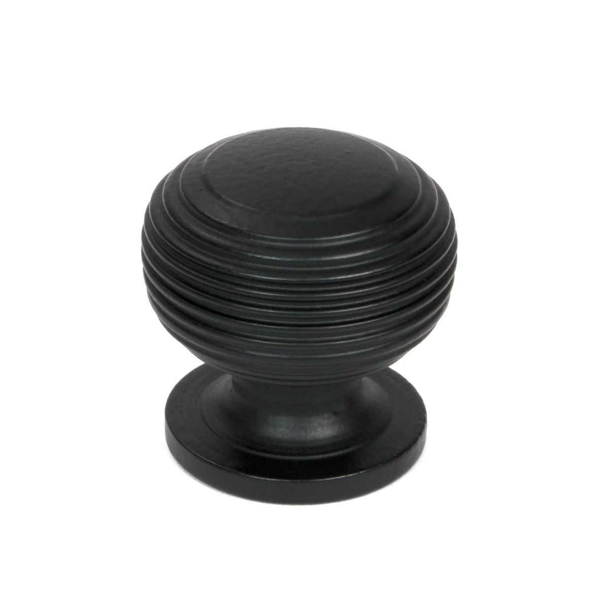 The 30mm "Garrison" Ribbed Beehive Knob in Matt Black on a White Background Shown Upright 