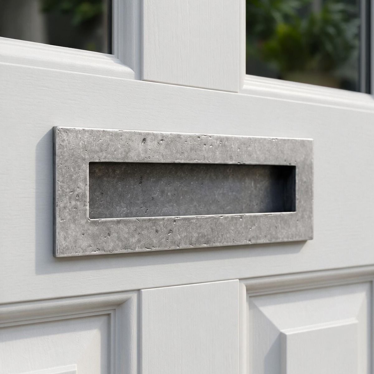 The 32cm Pewter Cast Traditional Letter Plate Mounted on a Bright White Timber Door