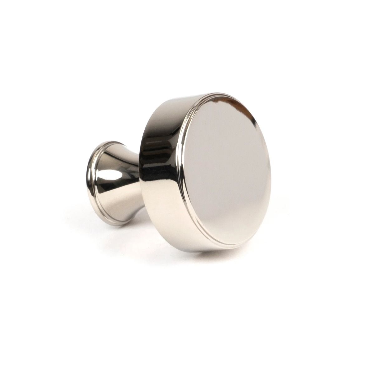 The 32mm "Atelier" Circular Cabinet Knob in Polished Nickel on a White Background Shown from Side on