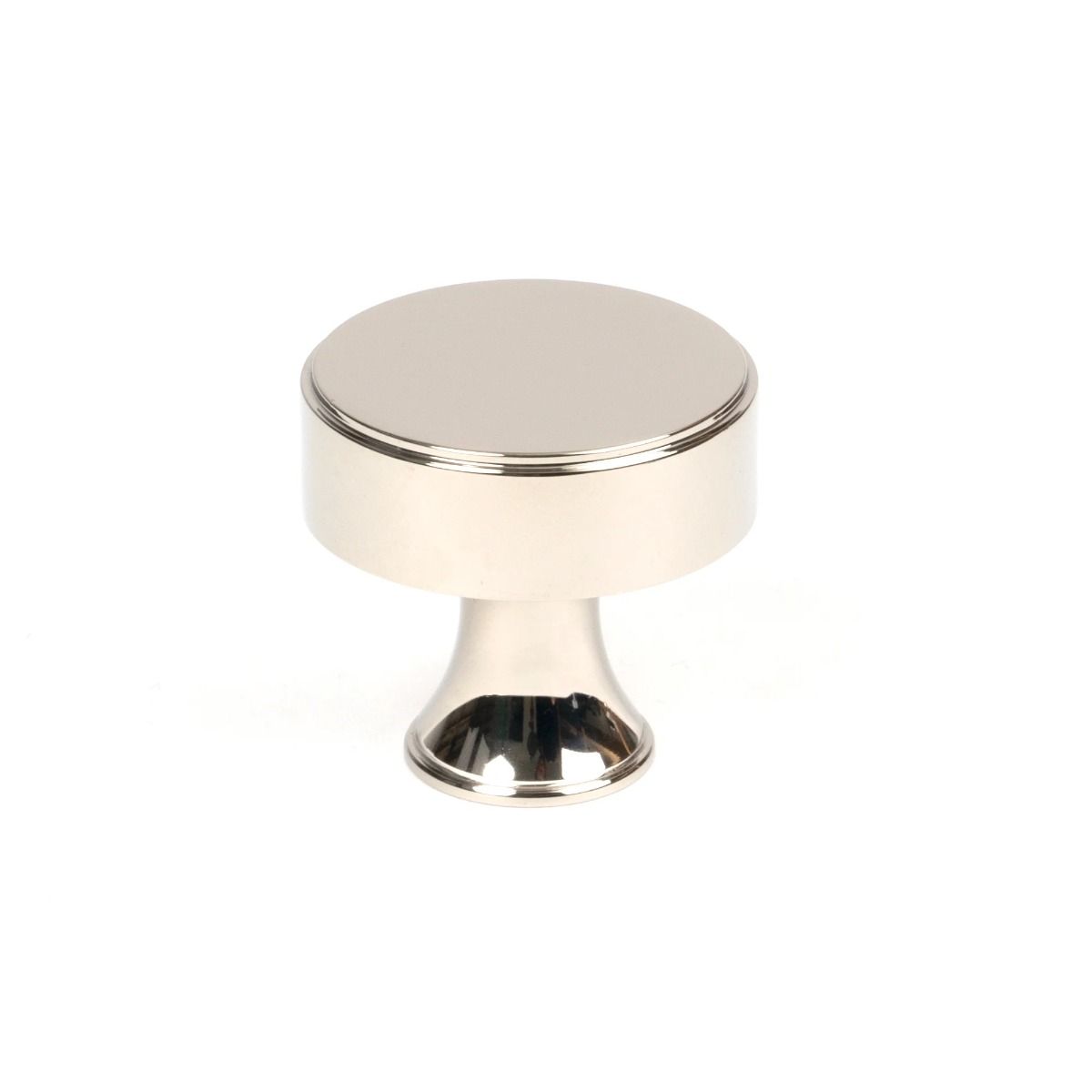 The 32mm "Atelier" Circular Cabinet Knob in Polished Nickel on a White Background Shown Upright 