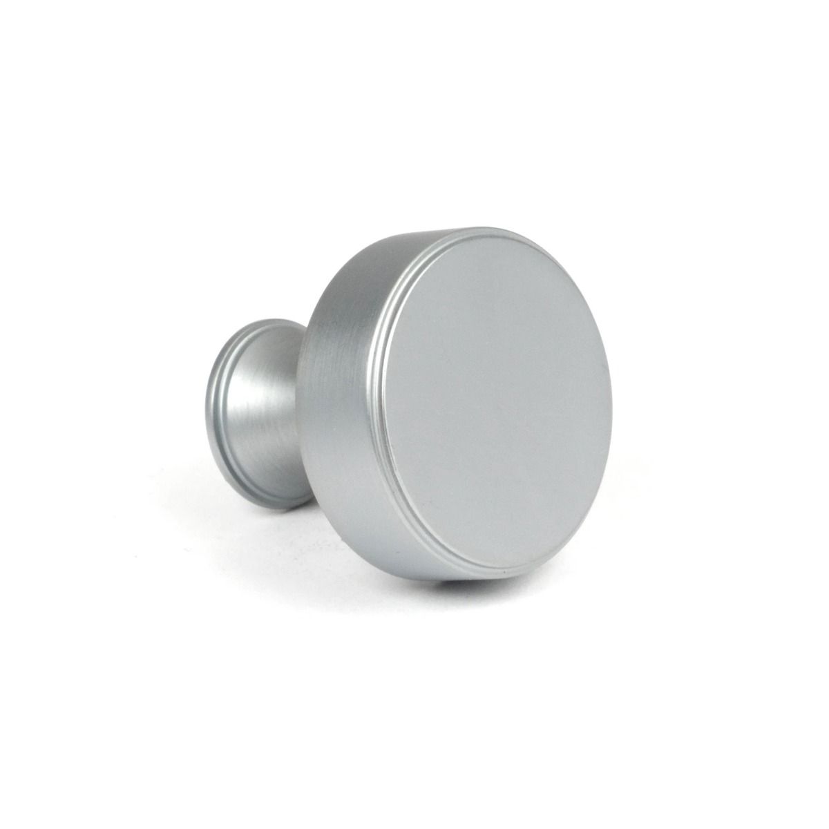 The 32mm "Atelier" Circular Cabinet Knob in Satin Chrome on a White Background Shown Side on