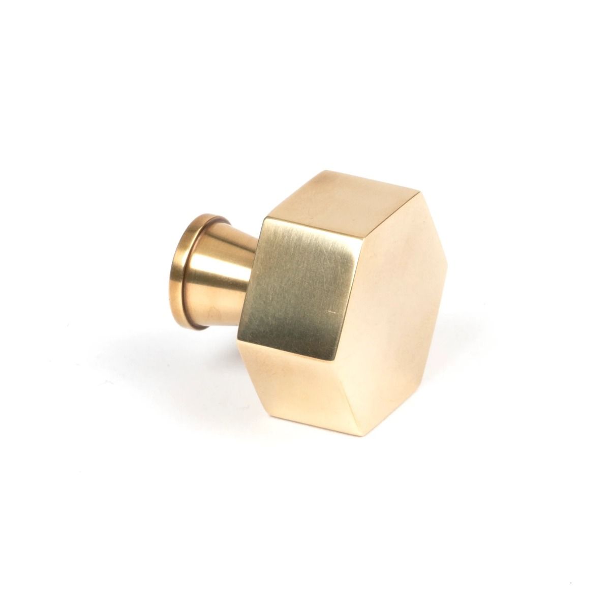The 32mm "Vanguard" Hexagonal Cabinet Knob in Aged Brass on a White Background Shown from the Side